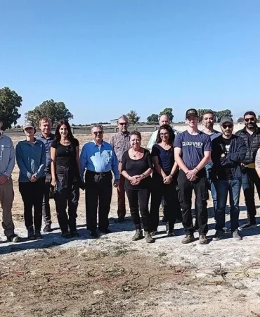 1782749075652sevgul-uludag-with-cmp-employees-at-a-field-site.jpg
