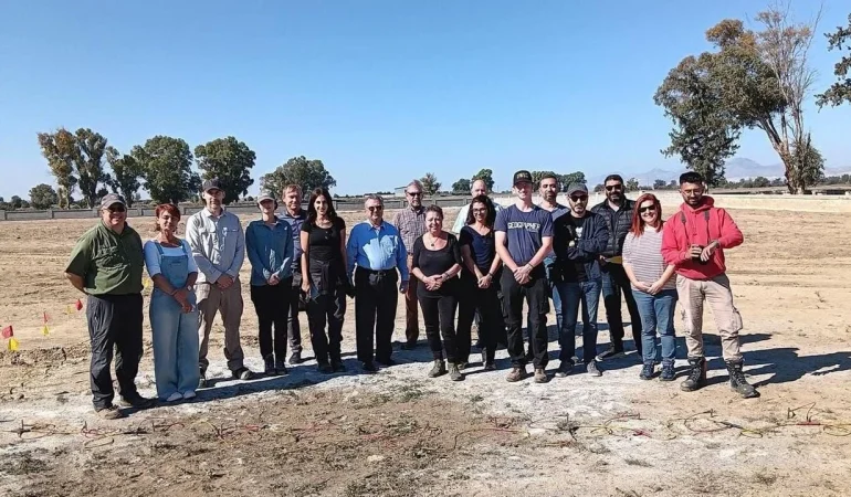 1782749075652sevgul-uludag-with-cmp-employees-at-a-field-site.jpg